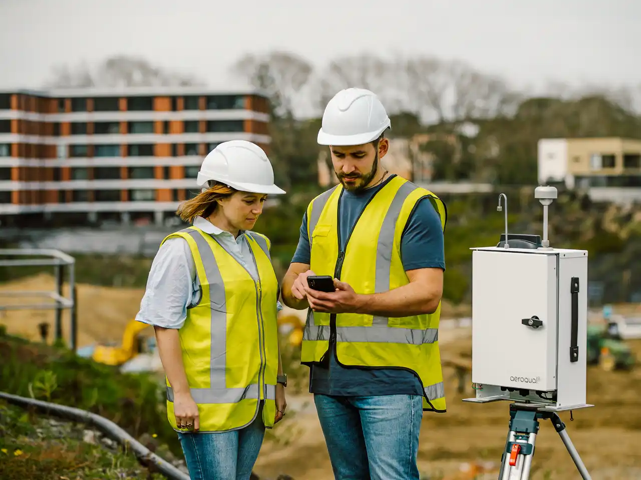 Air quality specialist with monitoring equipment