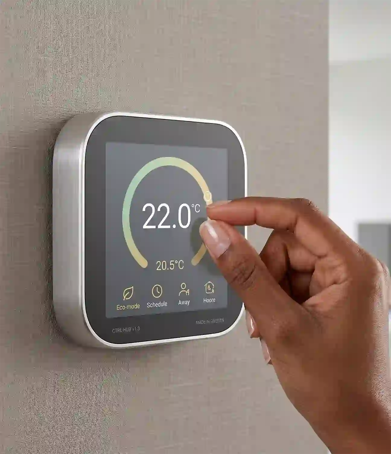Technician adjusting smart thermostat